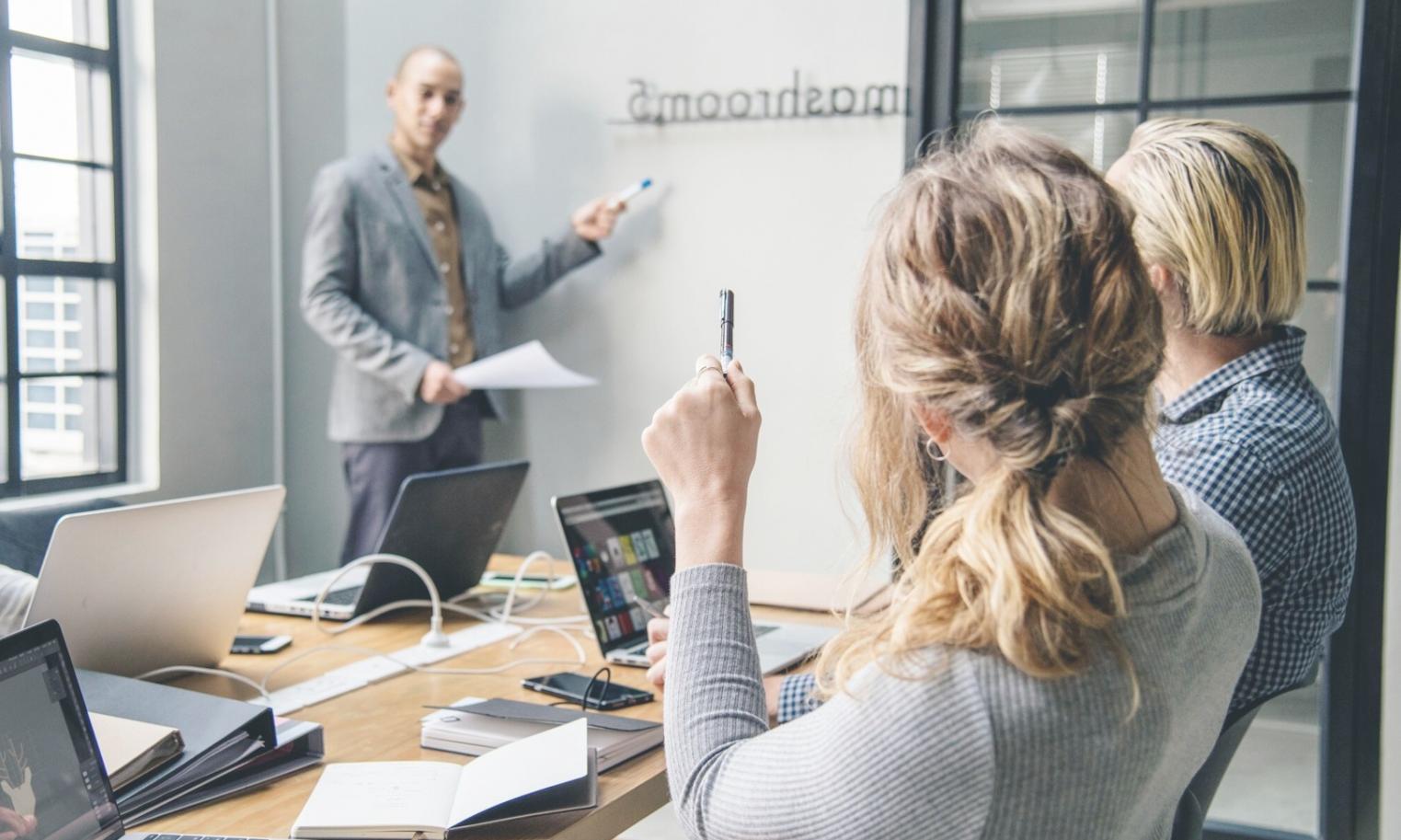 Business professional analyzing financial documents and budget spreadsheets